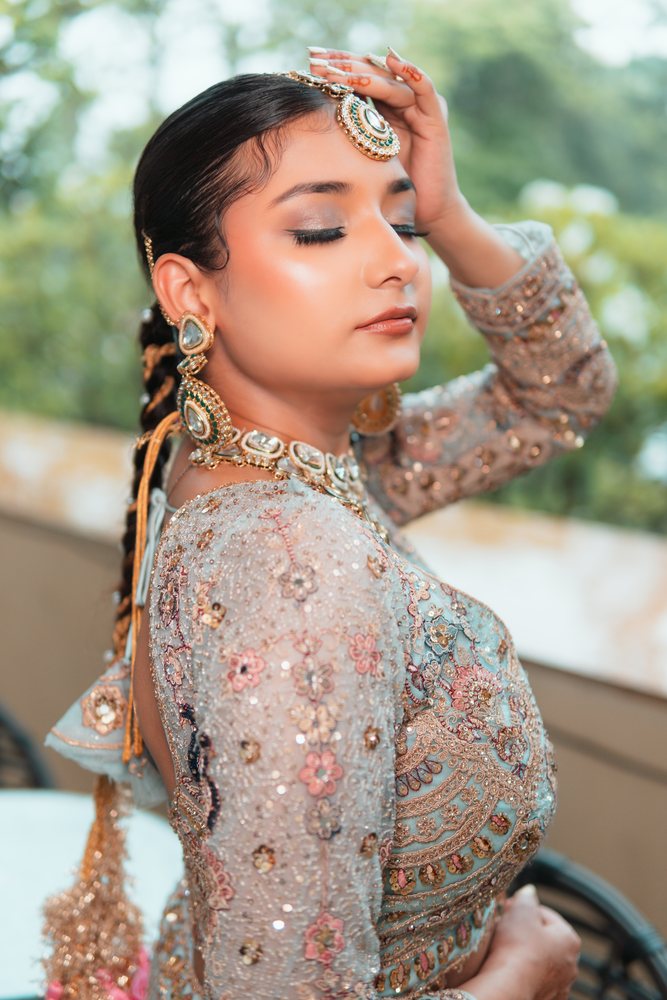 Bridal — teal lehenga, mehndi hands
