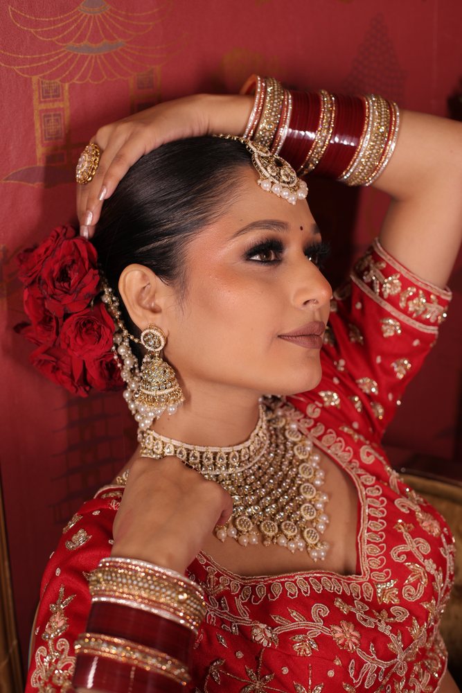 Bridal — red lehenga, kohl eyes, red roses