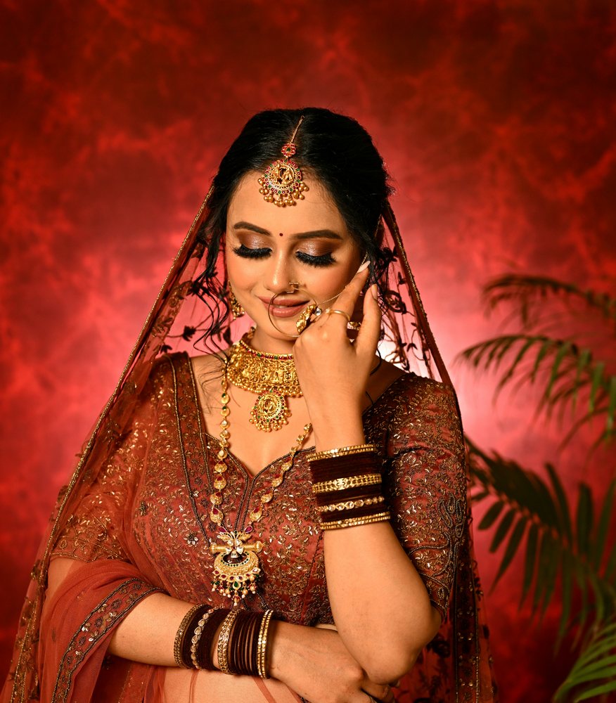 Bridal — brown lehenga, gold jewellery, soft glam