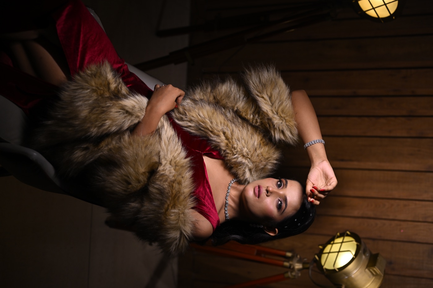 Editorial glam portrait — red velvet outfit with fur stole