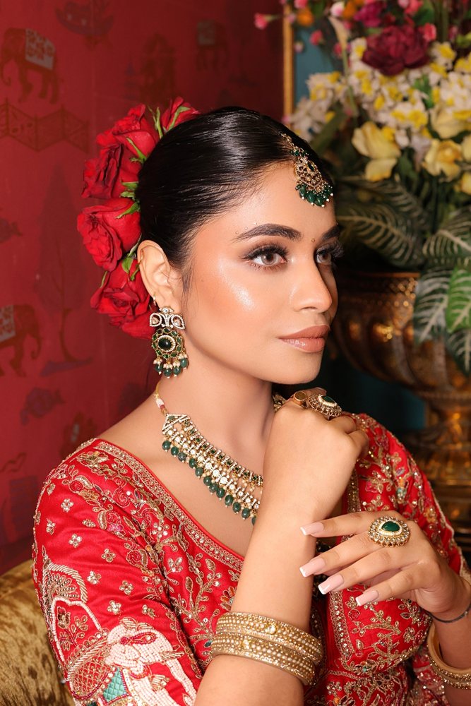 Bridal makeup — red lehenga, green jewellery, Gorakhpur